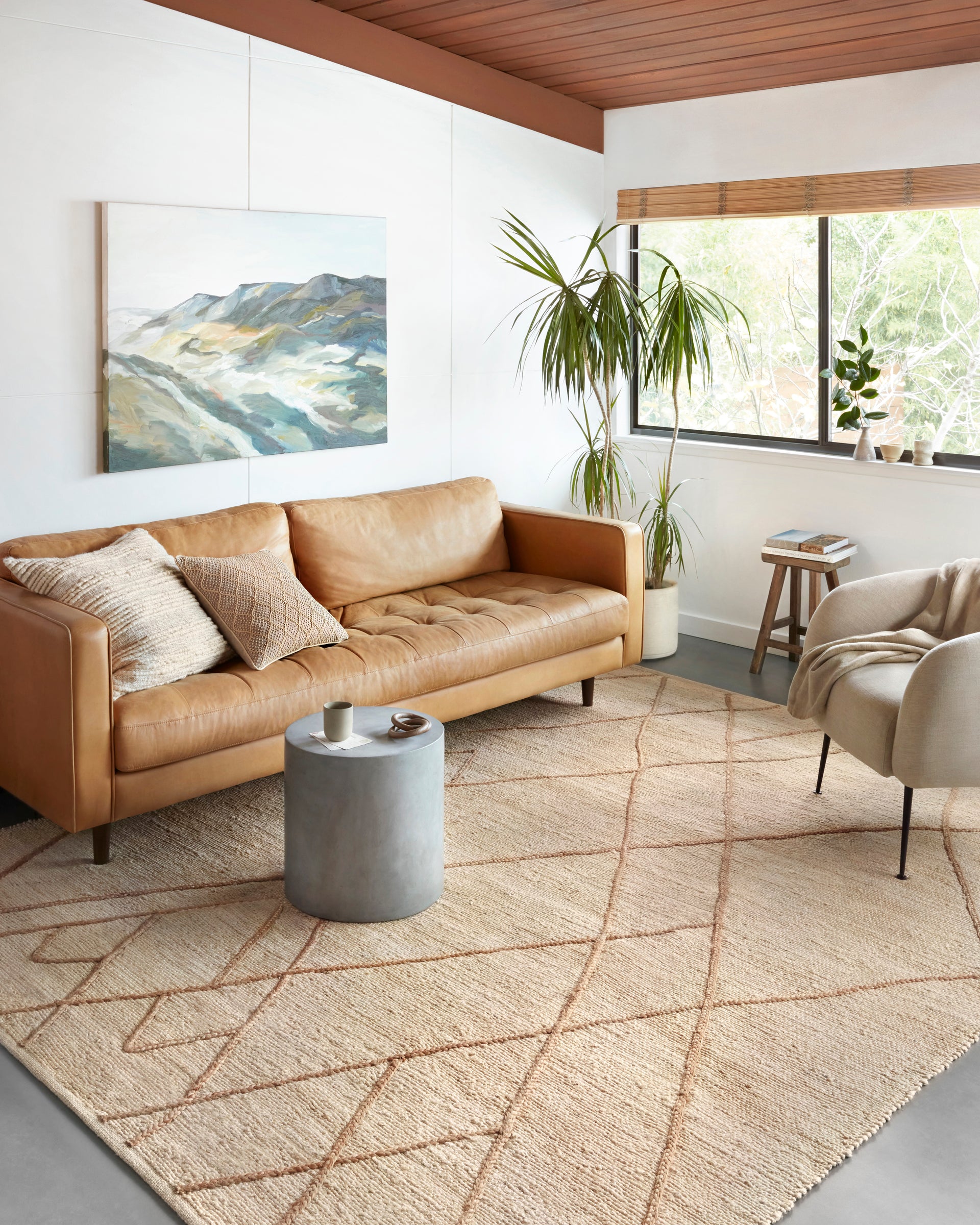 Braided Beauty: Elevate Your Décor with the Bodhi Jute Rug, Original Image with Sofa Set